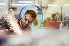 man working with machine sparks